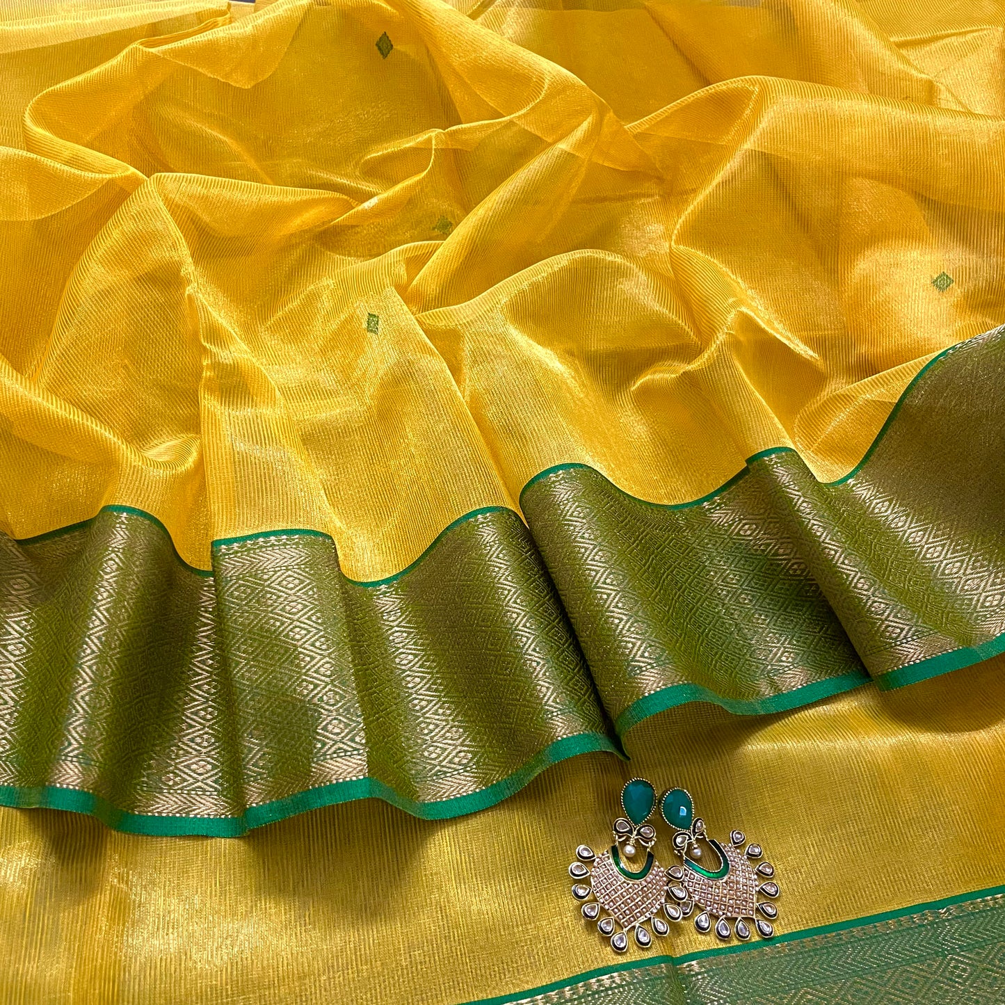 Yellow and green maheshwari tissue silk saree with zari bootis all over