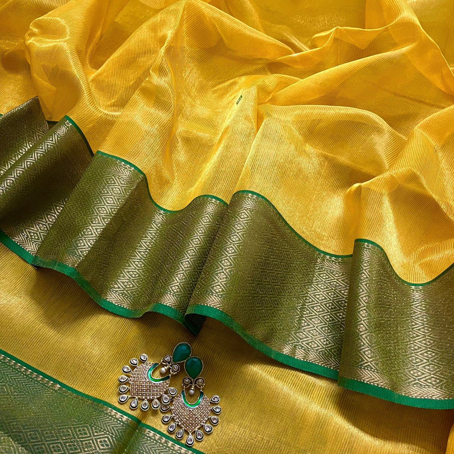 Yellow and green maheshwari tissue silk saree with zari bootis all over