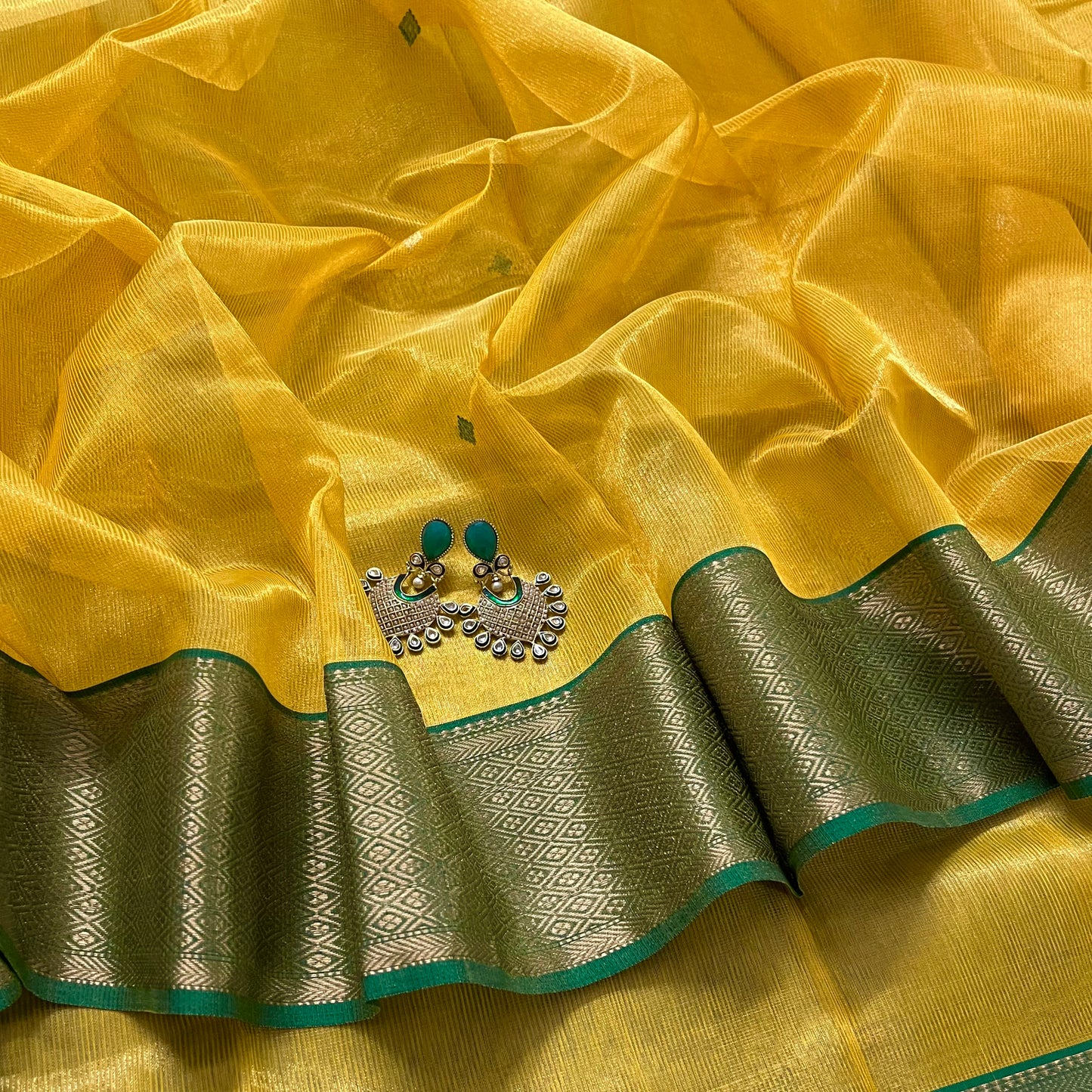 Yellow and green maheshwari tissue silk saree with zari bootis all over