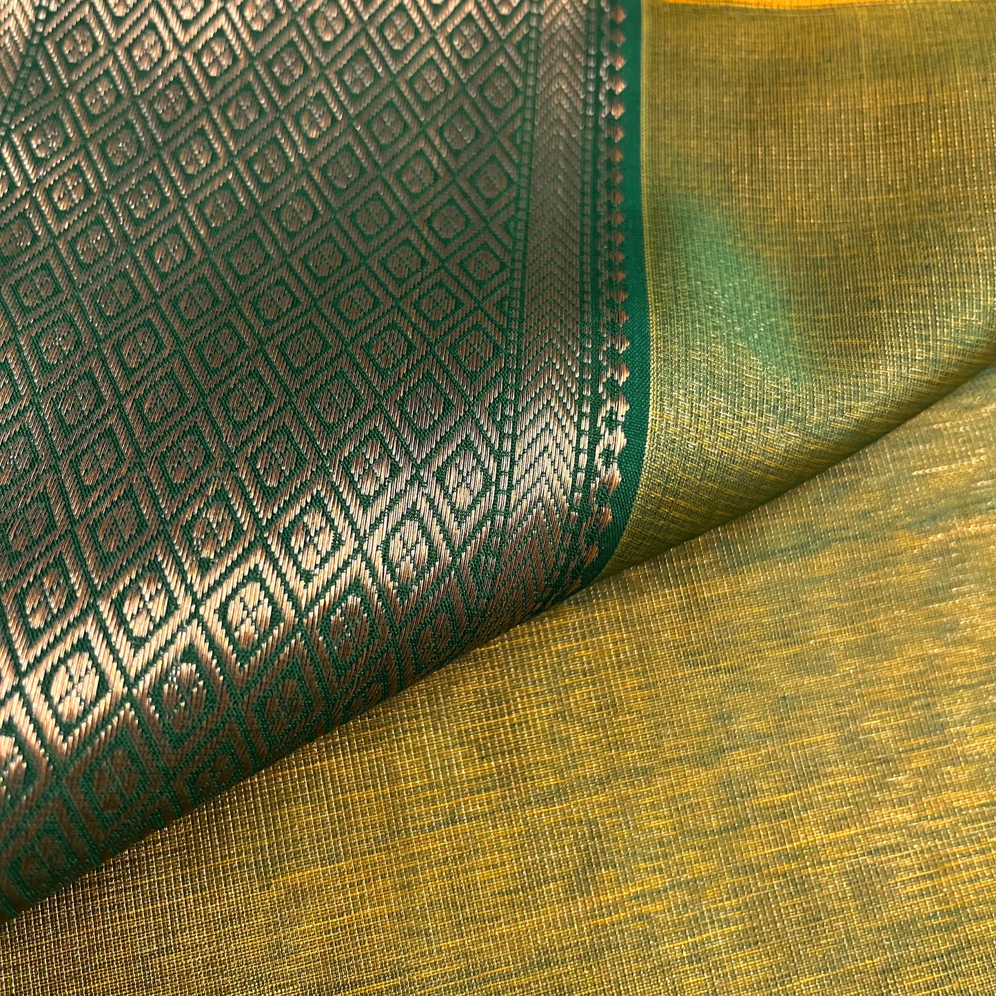 Yellow and green maheshwari tissue silk saree with zari bootis all over