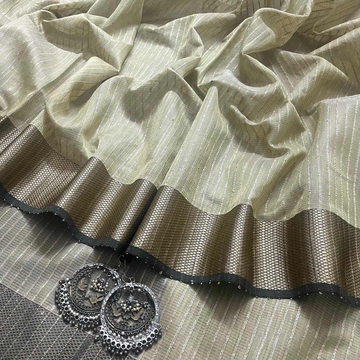 Light olive maheshwari saree with threadwork all over and jute striped pallu