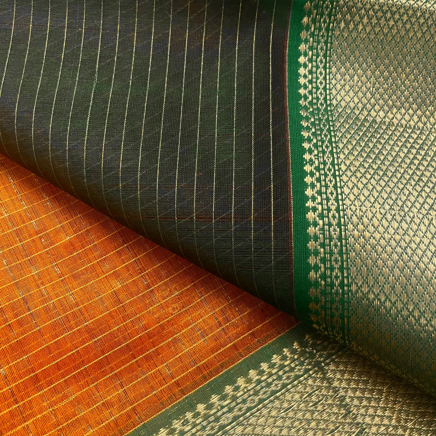 Rust and green maheshwari saree with zari checks all over