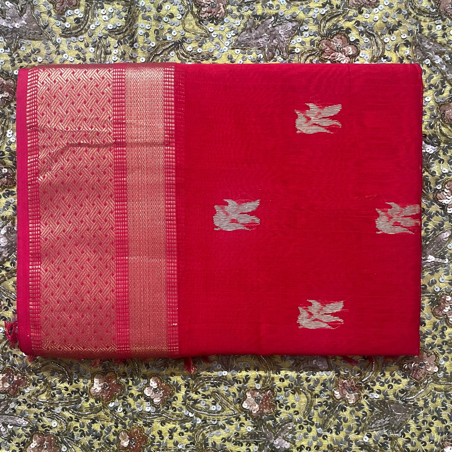 Red maheshwari saree with flower motifs on pallu