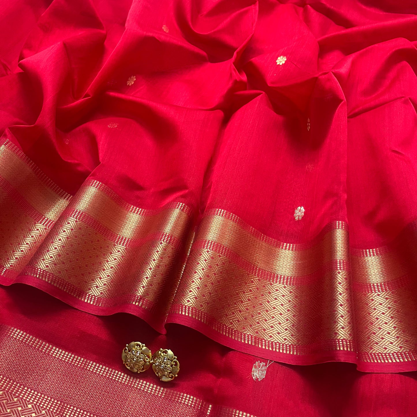 Red maheshwari saree with flower motifs on pallu