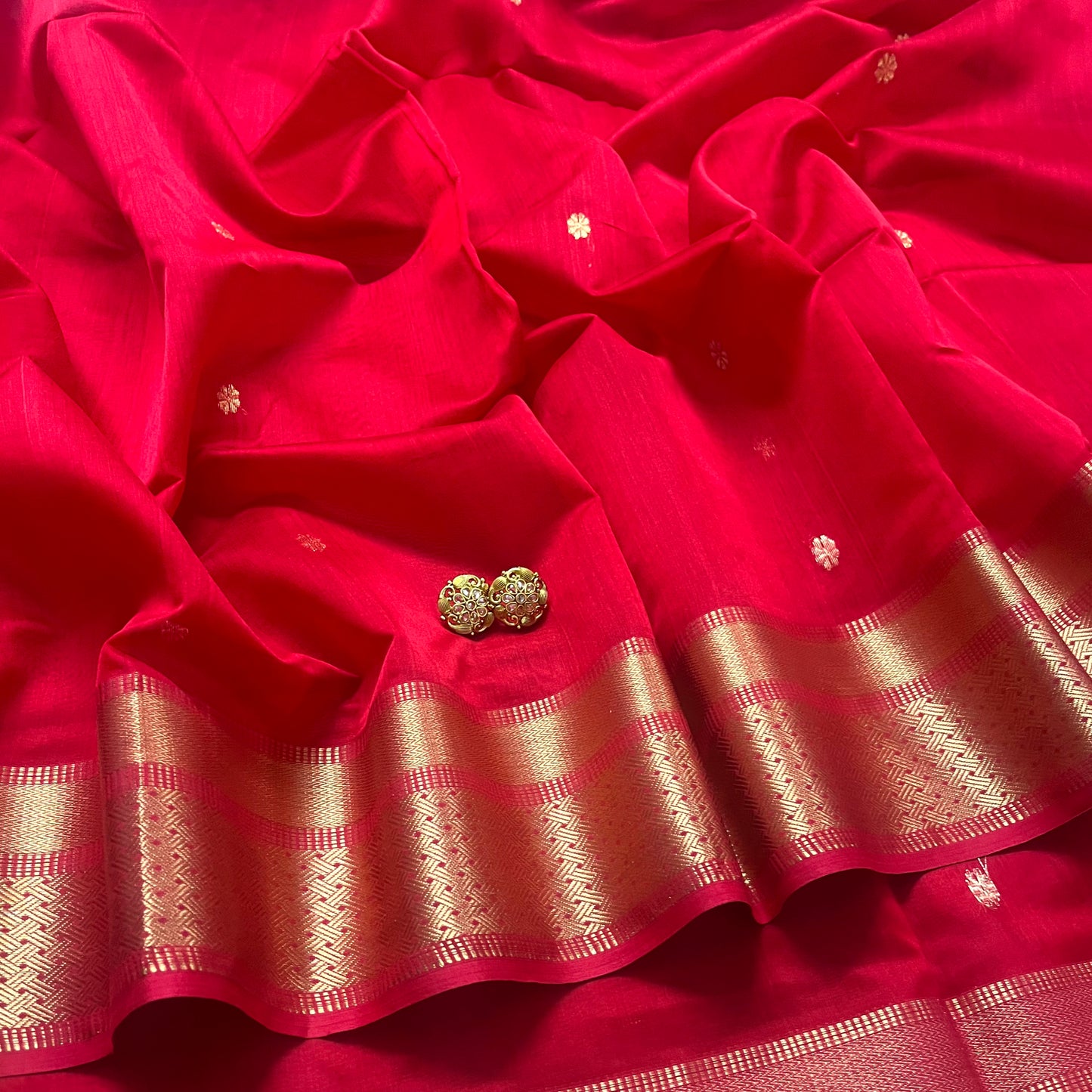 Red maheshwari saree with flower motifs on pallu