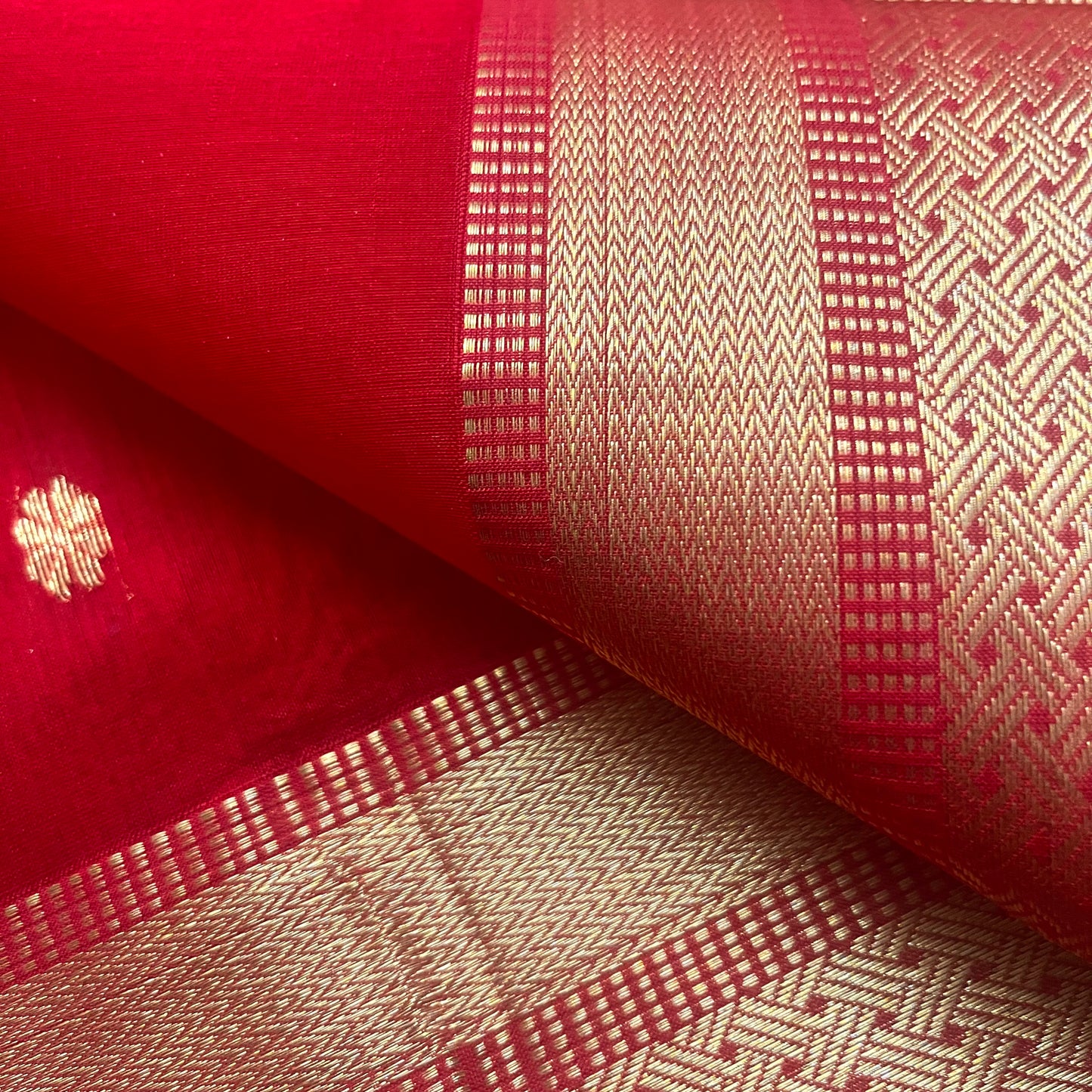 Red maheshwari saree with flower motifs on pallu