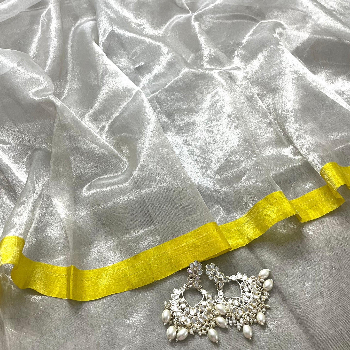 (Shop the look) Silver white and lemon chanderi tissue silk saree