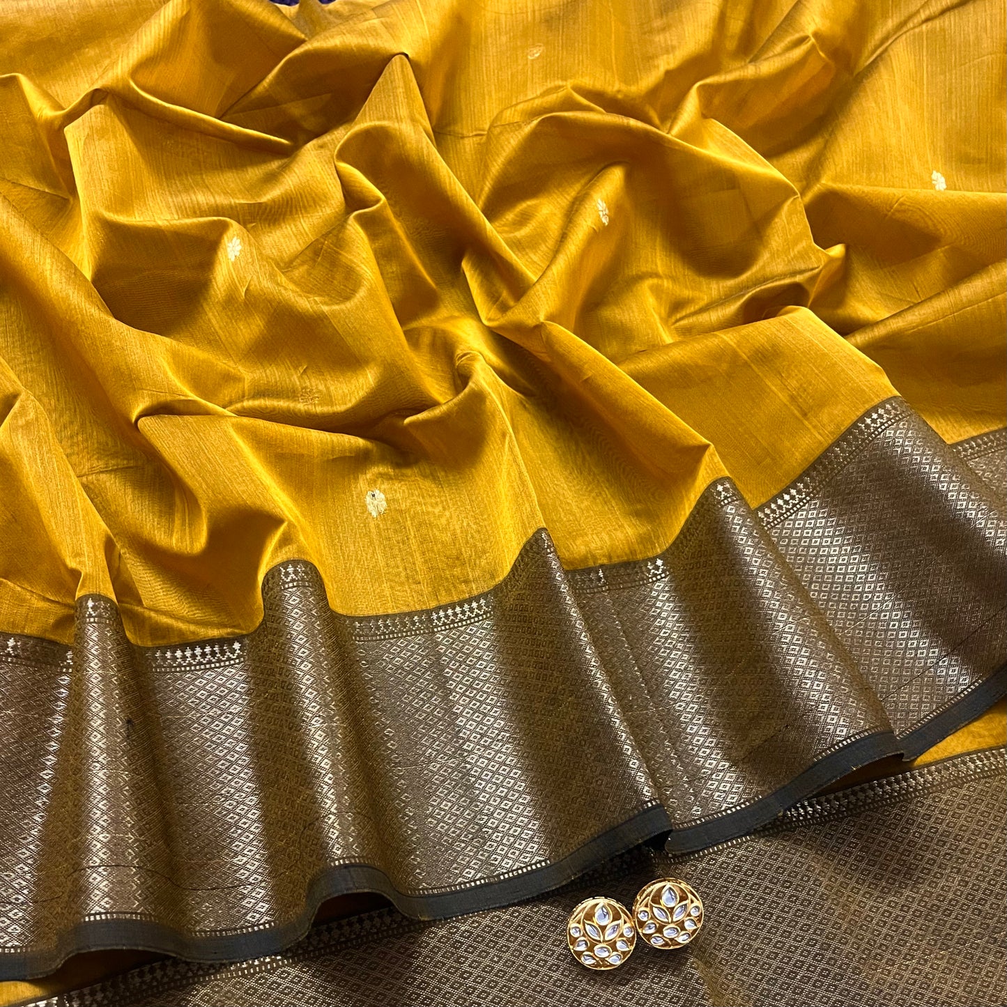 Mustard maheshwari saree with flower bootis all over