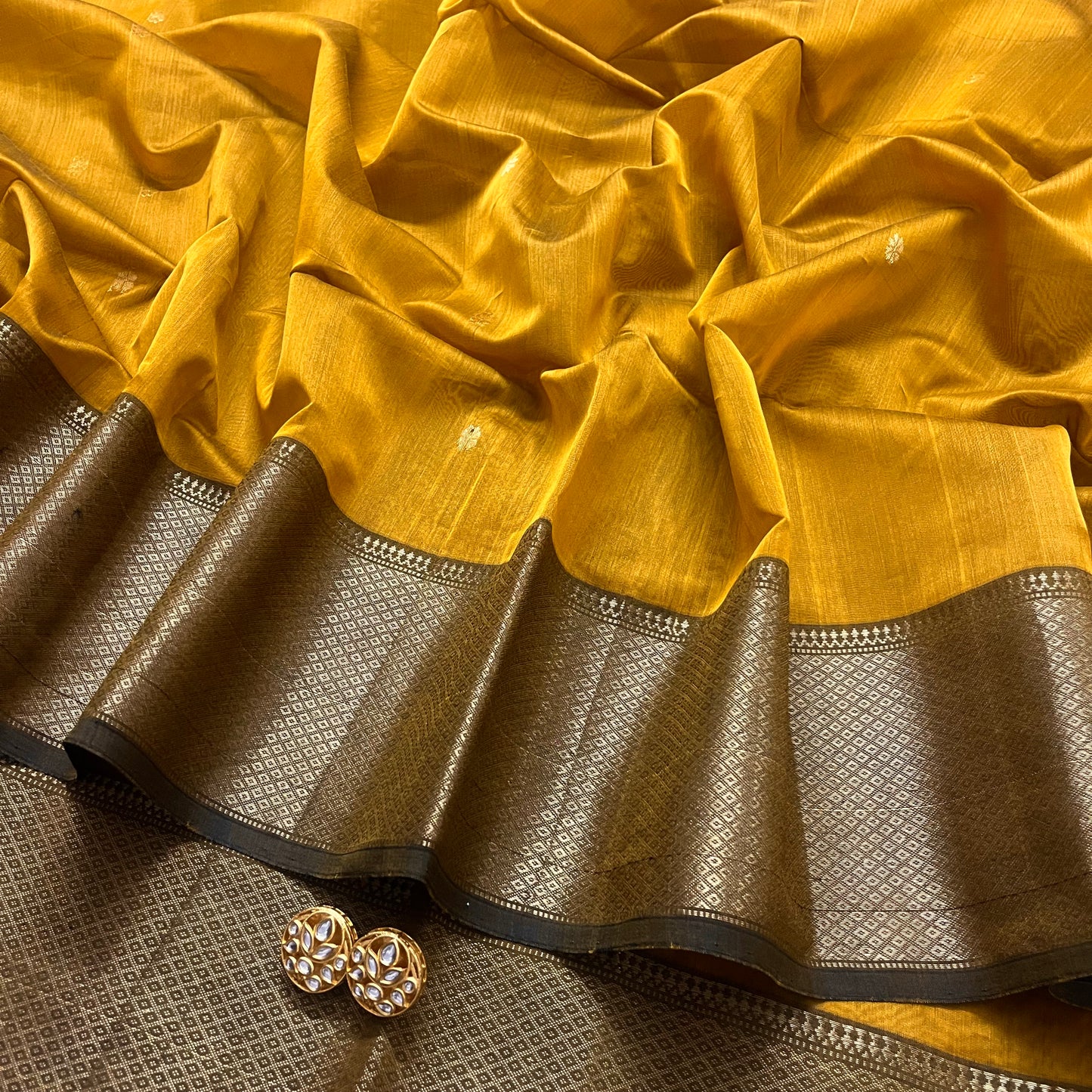 Mustard maheshwari saree with flower bootis all over