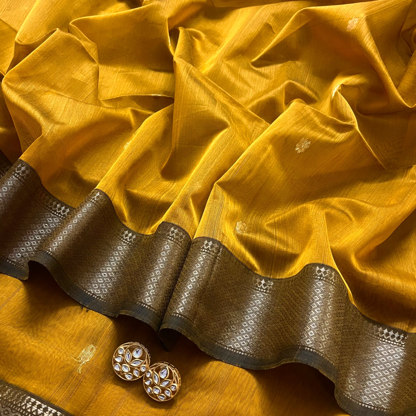 Mustard maheshwari saree with flower bootis all over