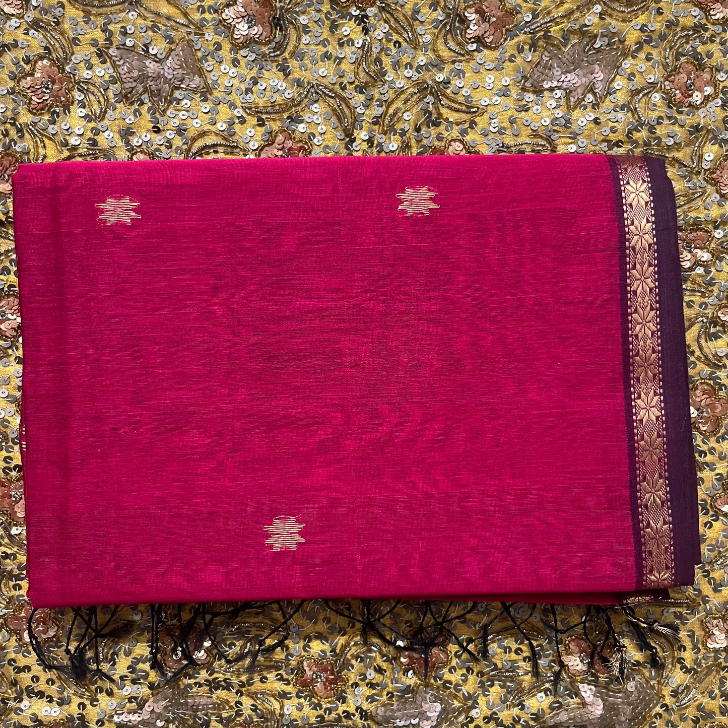 Deep pink maheshwari saree with flower bootis all over