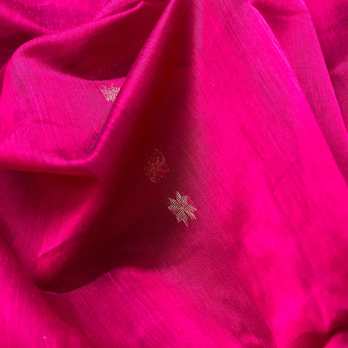 Deep pink maheshwari saree with flower bootis all over