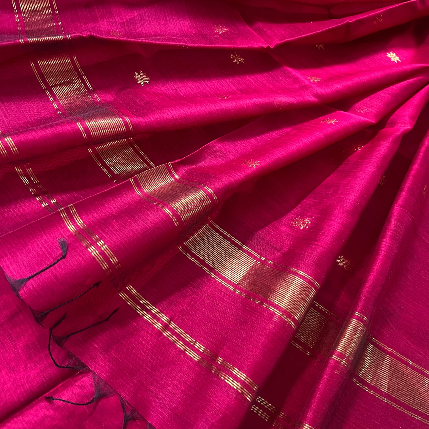 Deep pink maheshwari saree with flower bootis all over