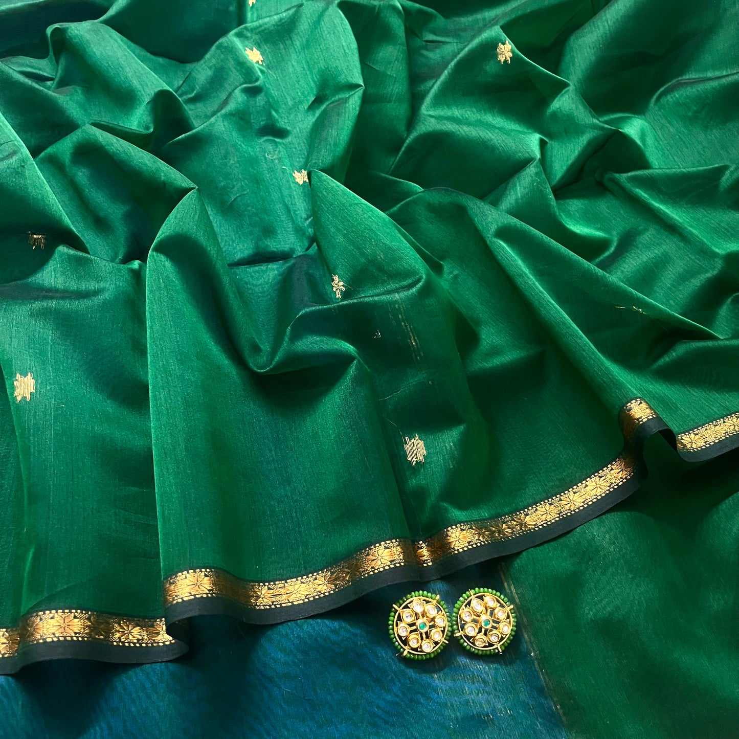 Green and blue maheshwari saree with flower bootis all over