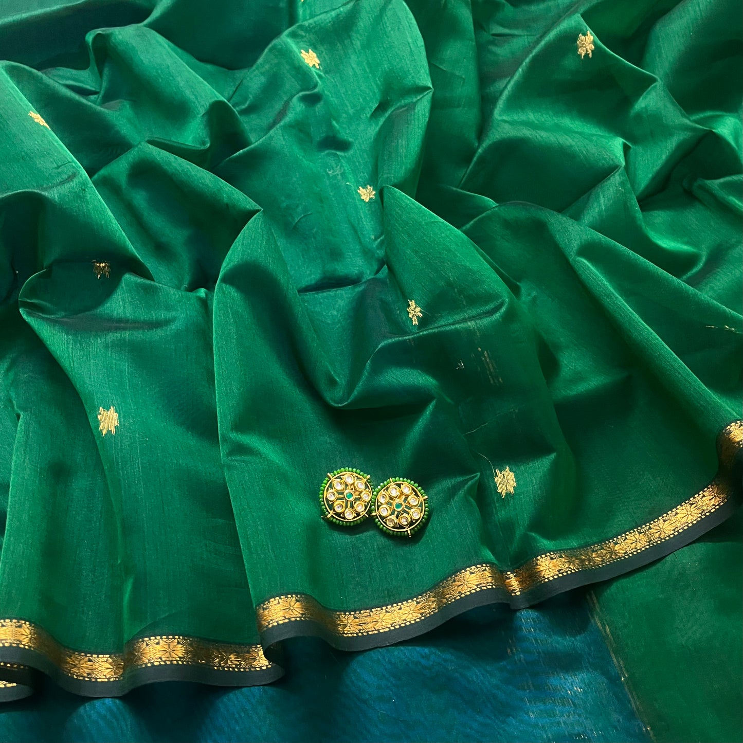 Green and blue maheshwari saree with flower bootis all over