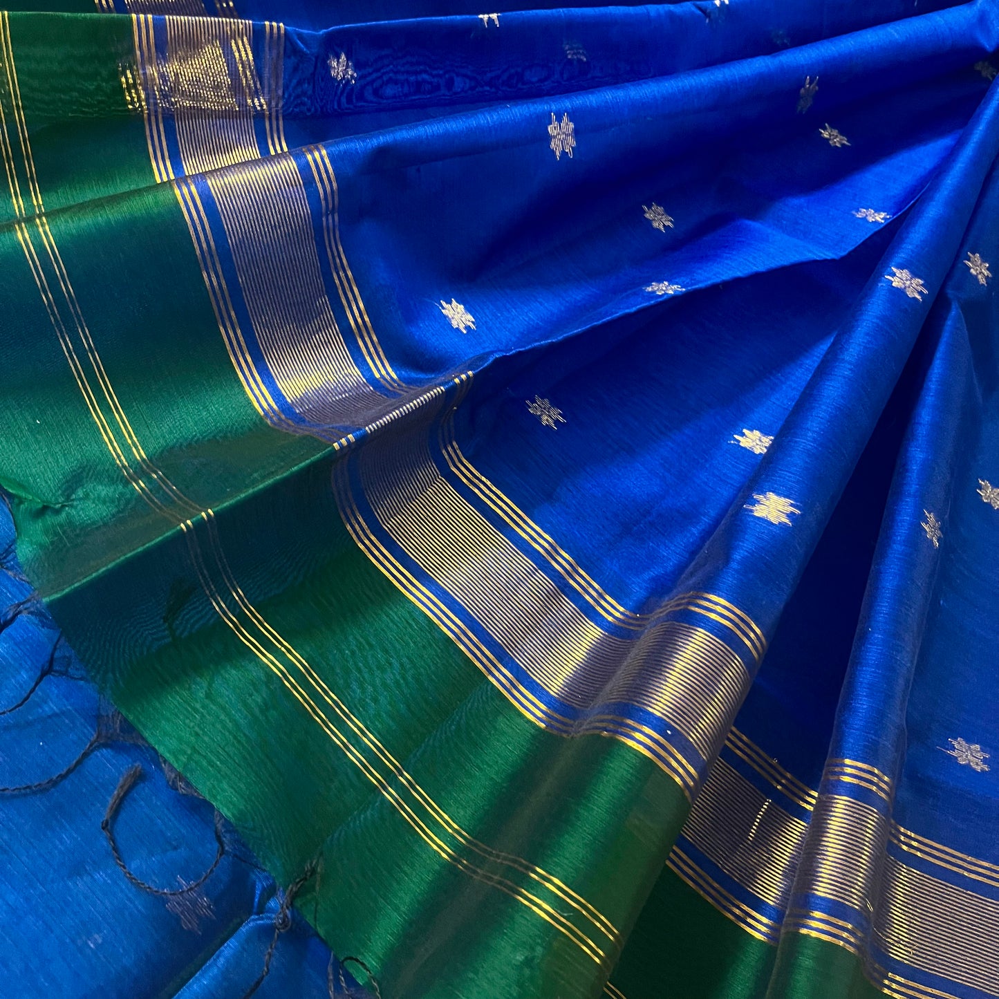 Green and blue maheshwari saree with flower bootis all over